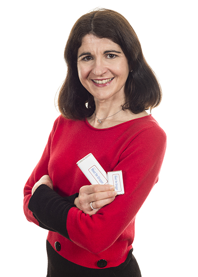 Mid shot of a business owner holding up her promotional chocolates